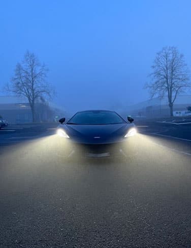 Sports cars in foggy conditions